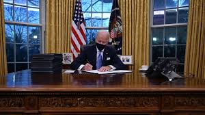 On first day Biden issues orders undoing key Trump policies